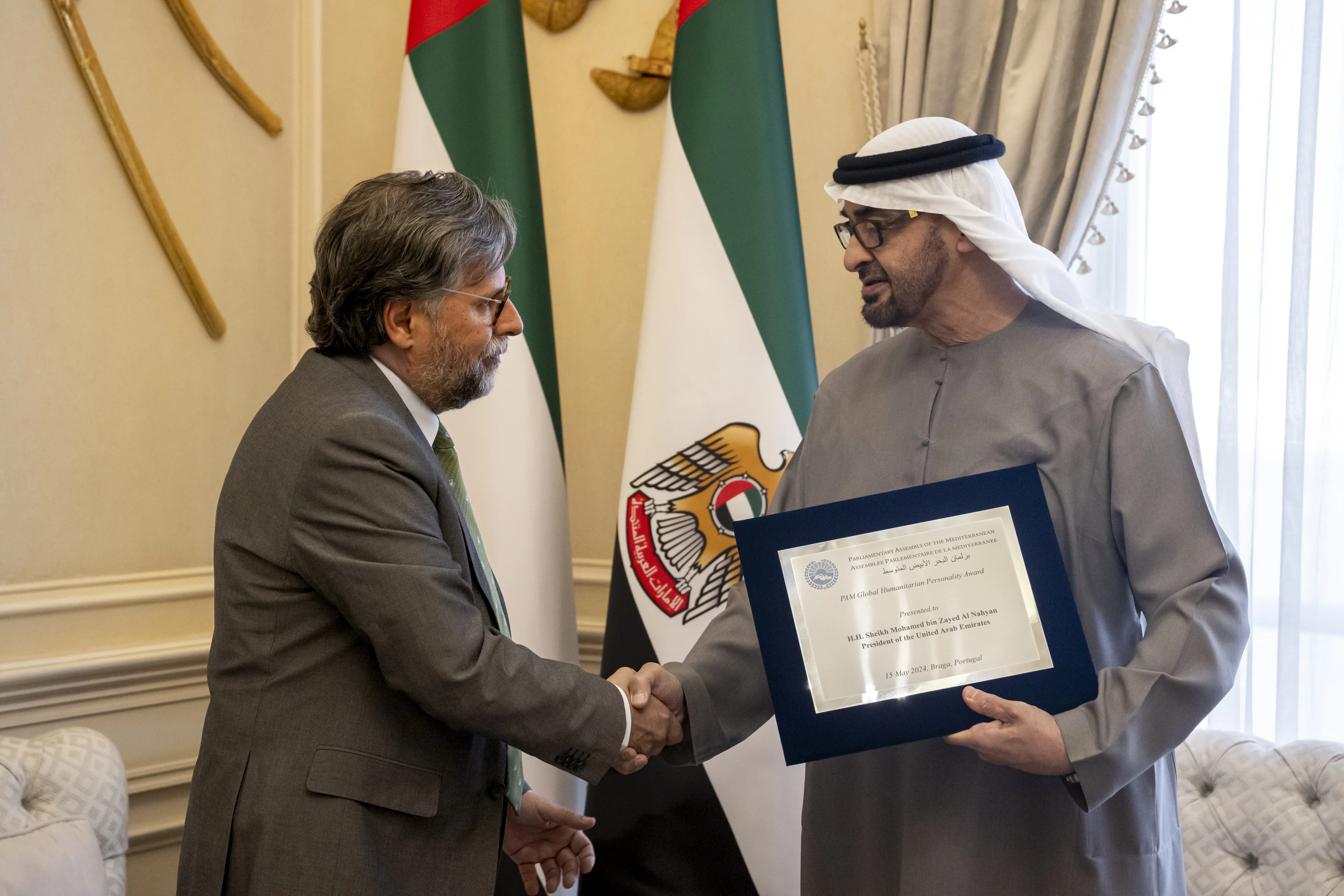 His Highness Sheikh Mohamed bin Zayed Al Nahyan, President of the United Arab Emirates, receives the ‘Global Humanitarian Personality' award, presented by Antonio Pedro Roque da Visitacao Oliveira, President of The Parliamentary Assembly of the Mediterranean, at the Sea Palace, May 2024