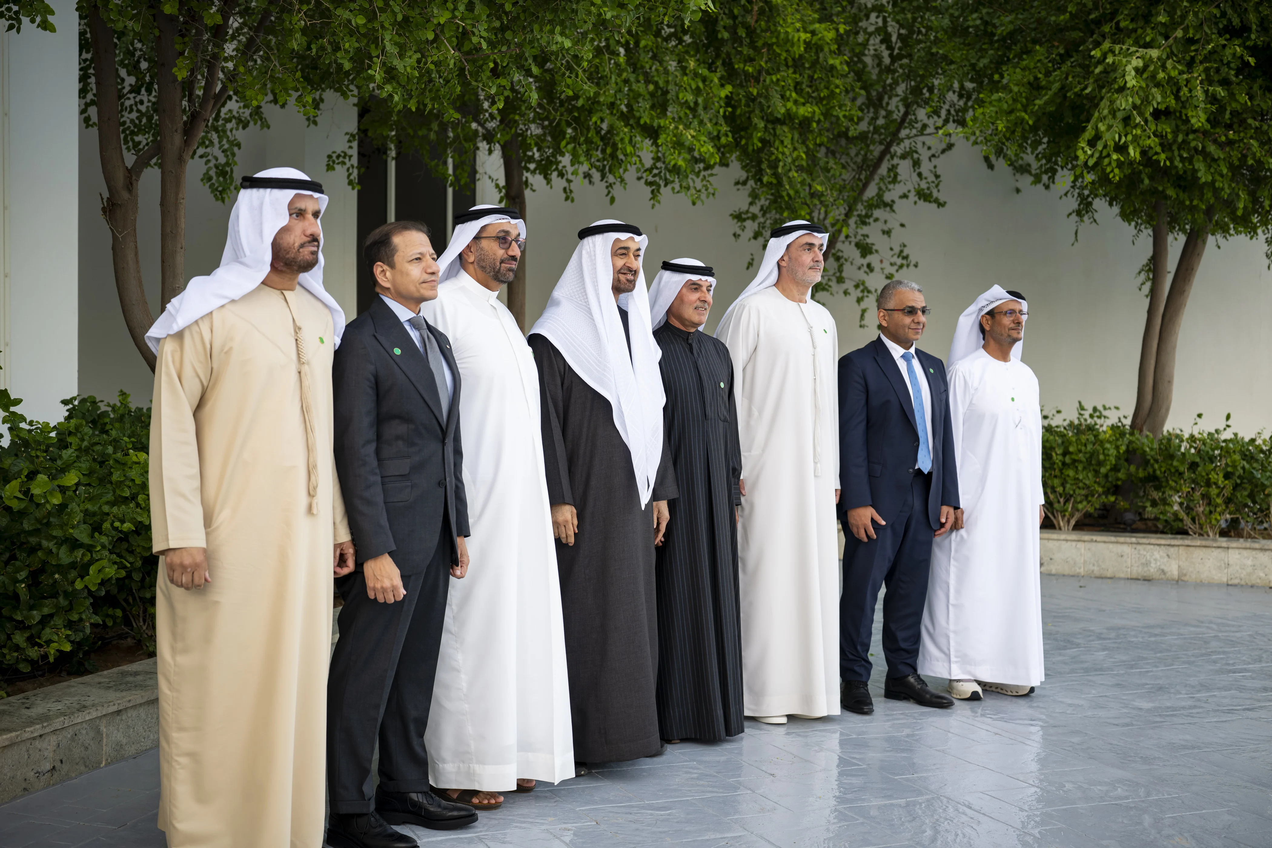 His Highness Sheikh Mohamed bin Zayed Al Nahyan, President of the United Arab Emirates, stands for a photograph with a delegation representing banks and financial institutions, during a Sea Palace barza. Seen with Abdul Aziz Abdullah Al Ghurair, December 2025